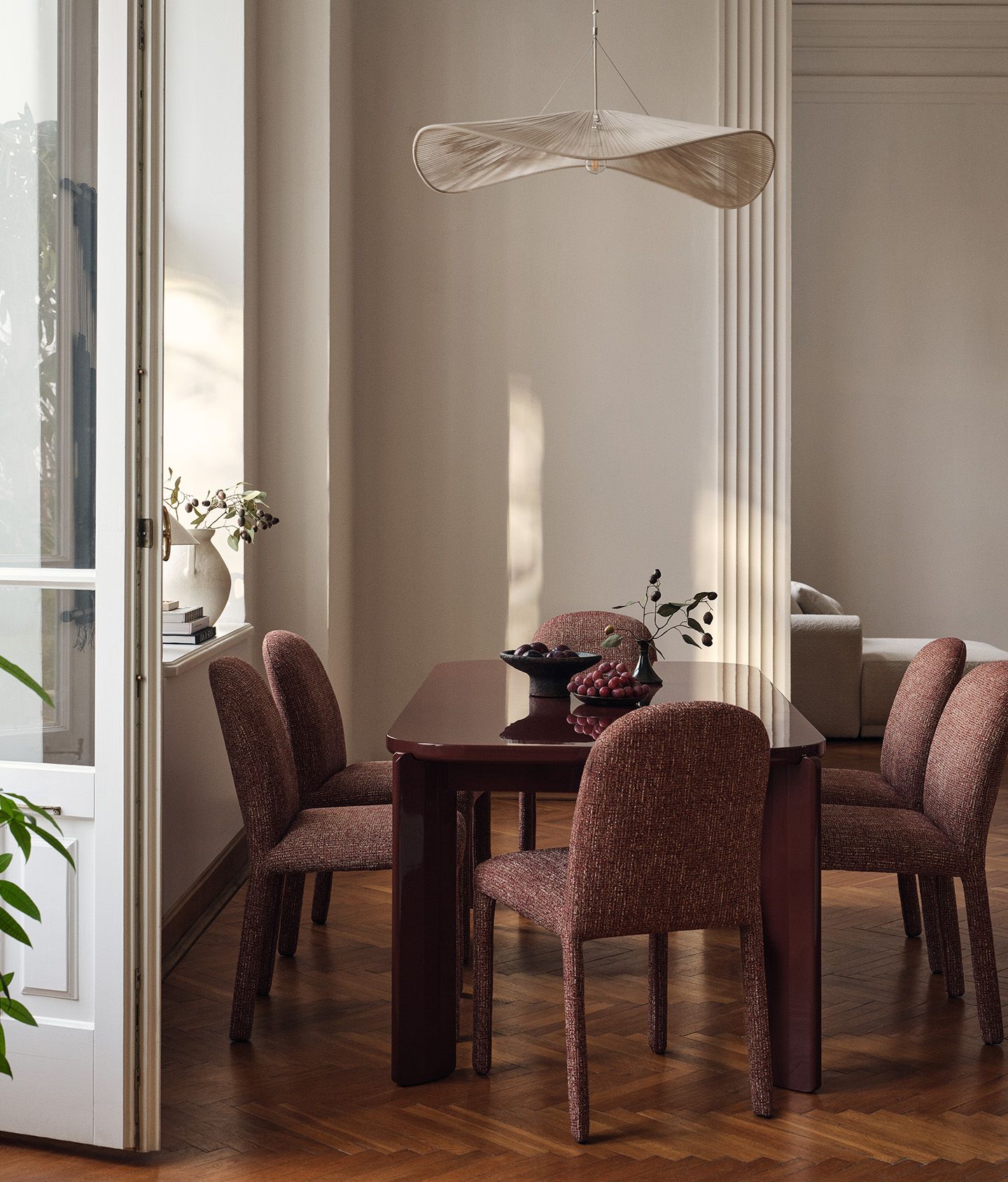 Gabana dining table with six Dolsa dining chairs in a classic interior setting.