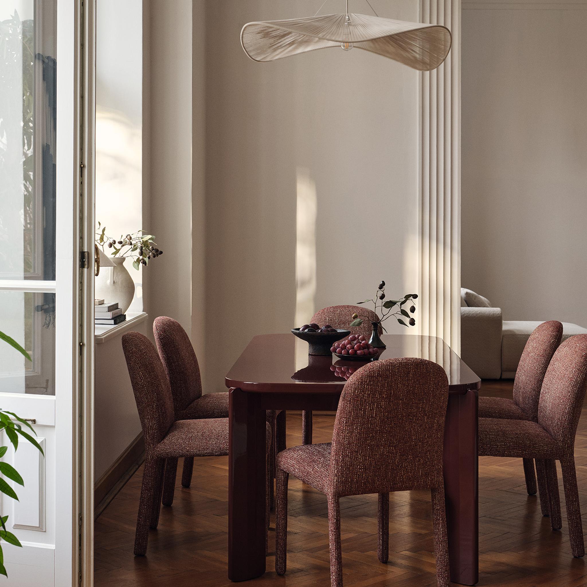 Gabana dining table with six Dolsa dining chairs in a classic interior setting.