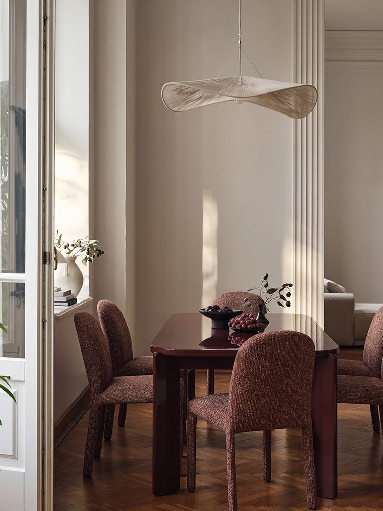 Gabana dining table with six Dolsa dining chairs in a classic interior setting.