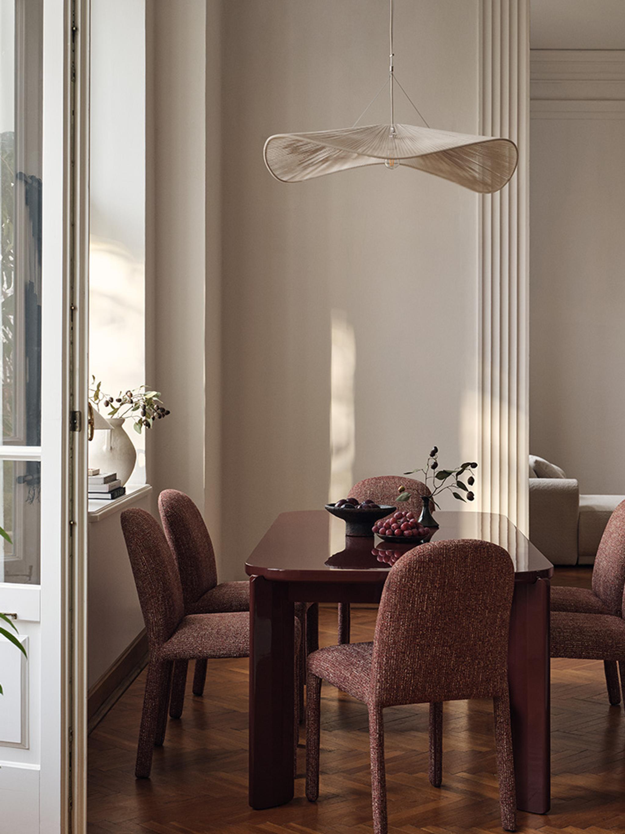 Gabana dining table with six Dolsa dining chairs in a classic interior setting.