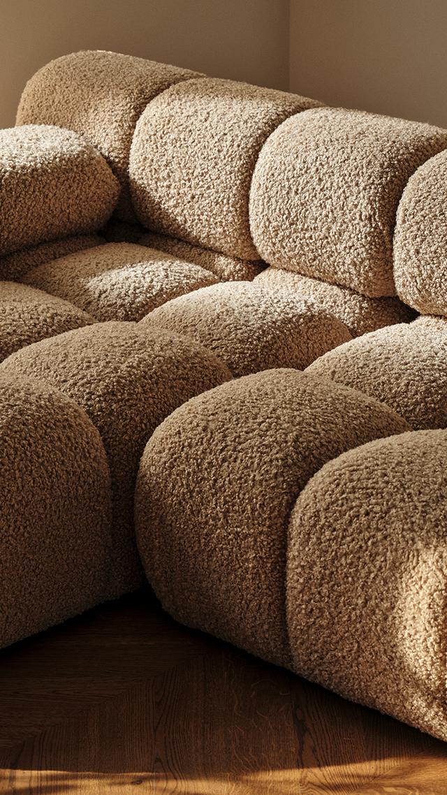 Bellis modular sofa in textured beige bouclé with deep tufted seats and soft sculptural form – Micadoni living room furniture