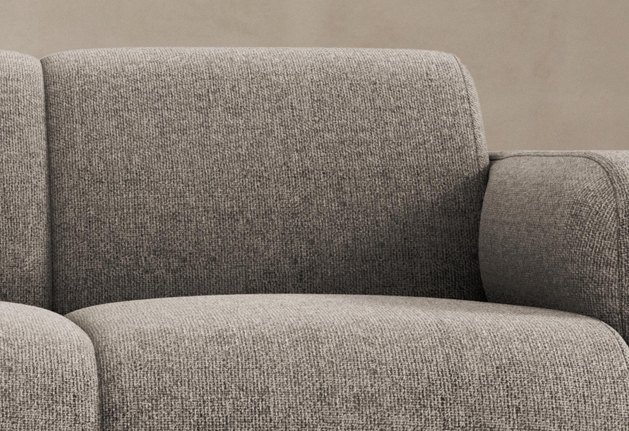 Canapé Molino en tissu gris texturé avec lignes arrondies et silhouette minimaliste – mobilier Micadoni